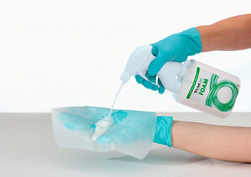 Disinfectant spray Tristel Jet FOAM being applied on Tristel Dry Wipe creating sporicidal foam for surfaces and equipment